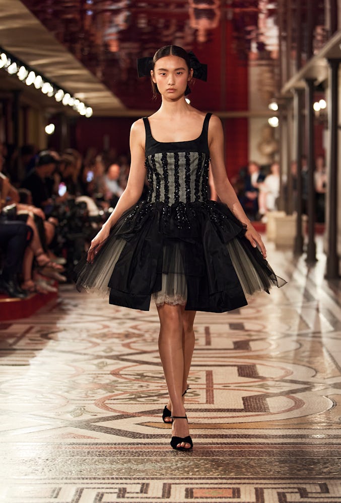a look from chanel couture fall 2024 collection runway show in paris