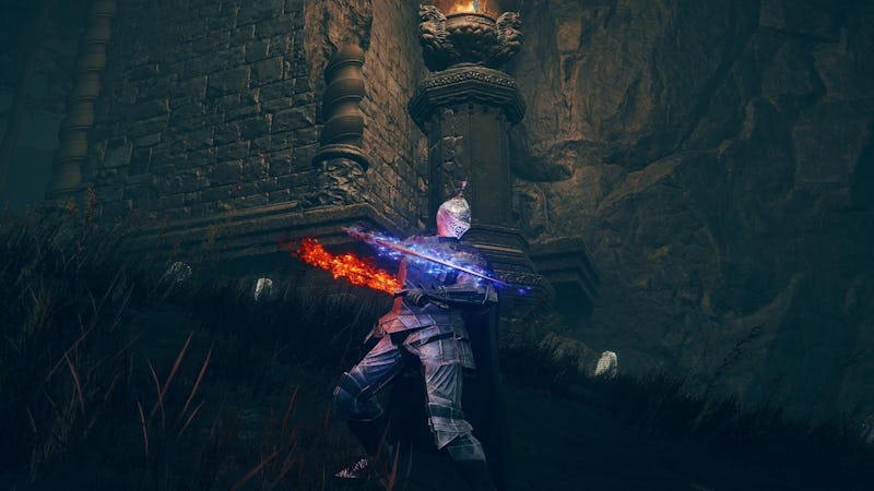 A knight with glowing blue armor stands near a stone pillar, holding a flaming blue and orange sword...