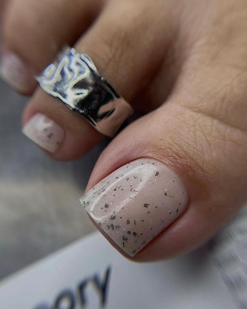 Neutral polish with silver flecks are perfect for Cancer season 2024.