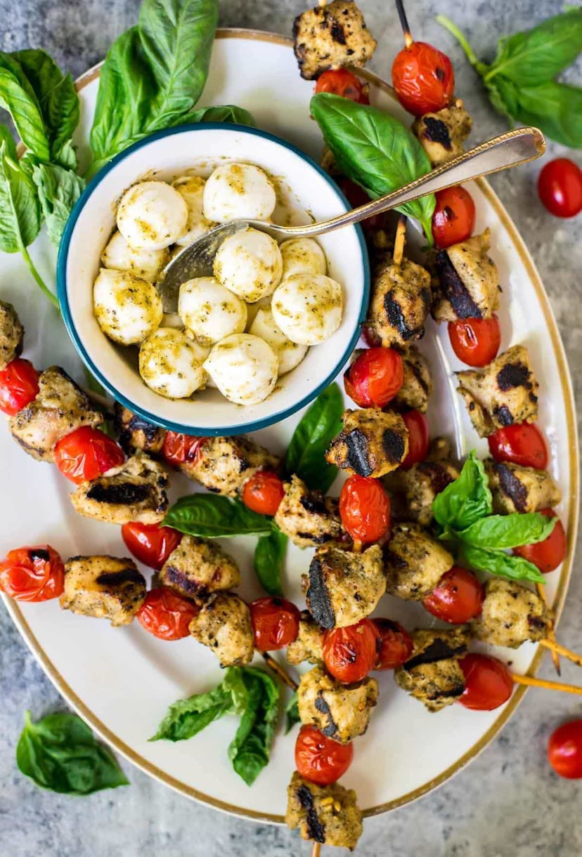 Grilled pesto chicken skewers is a make-ahead Fourth of July appetizer idea to enjoy.