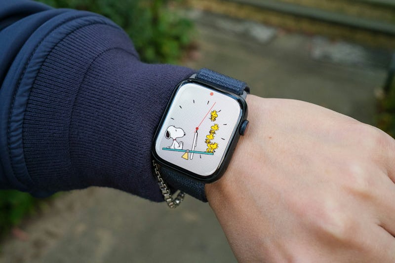 Image of an Apple Watch Series 9 with the Peanuts Snoopy watch face.