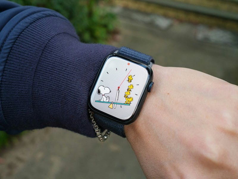 Image of an Apple Watch Series 9 with the Peanuts Snoopy watch face.