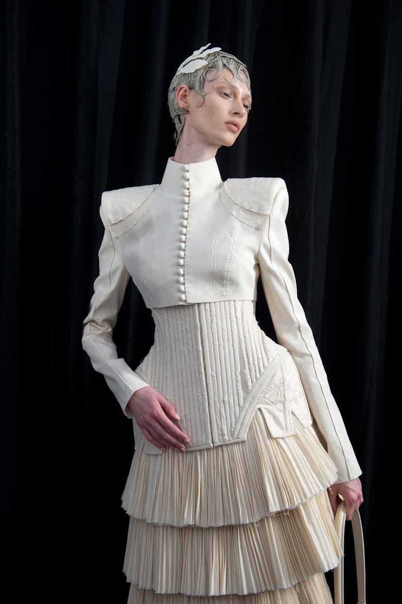 A model poses backstage prior to the Thom Browne Haute Couture Fall/Winter 2024-2025 show as part of...