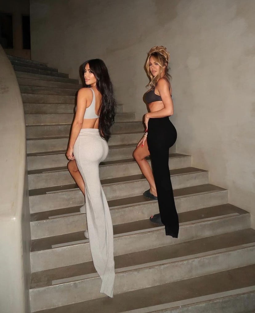 Kim Kardashian and Khloe Kardashian wore matching bra top outfits to celebrate the Good American fou...