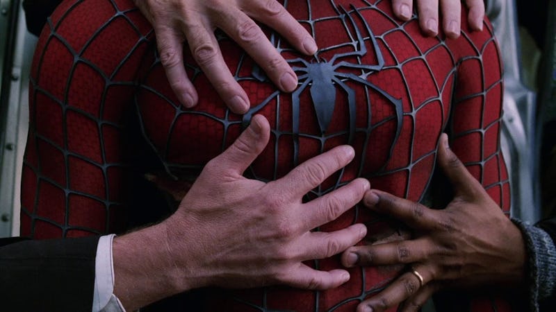 Hands grasp Spider-Man's superhero suit in 'Spider-Man 2'