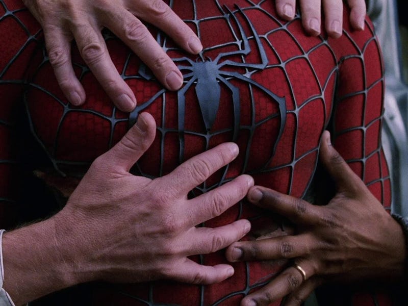 Hands grasp Spider-Man's superhero suit in 'Spider-Man 2'