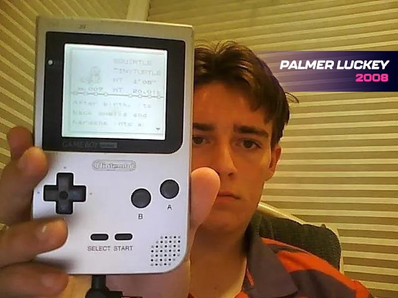 Palmer Luckey holding a chromatic Game Boy clone handheld made by Modretro.