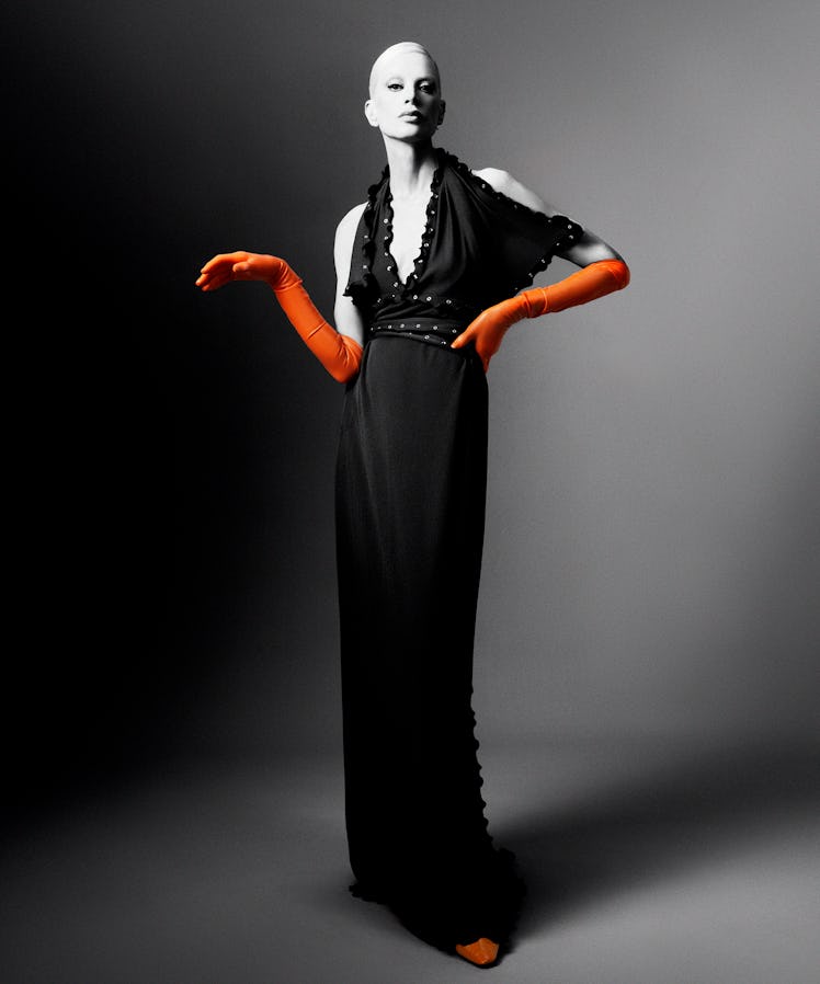 Kristen McMenamy wears a Burberry dress; Bottega Veneta shoes; stylist’s own gloves (throughout).