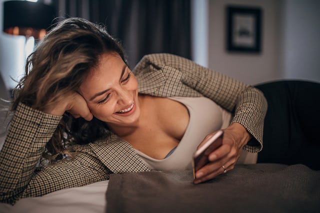 A woman laughs sending pick-up lines for girls.