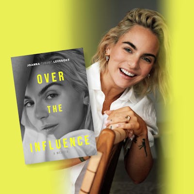 A woman with blonde hair smiling and holding a memoir titled "Over the Influence" by Joanna 'JoJo' Levesque.