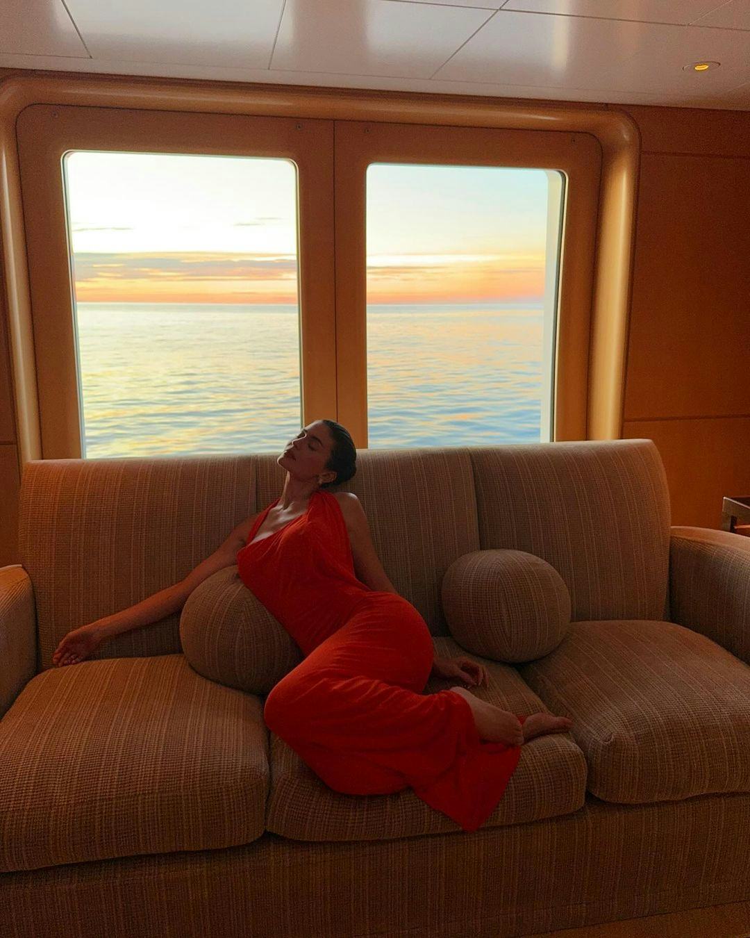 Kylie Jenner wears a red dress on her recent vacation.