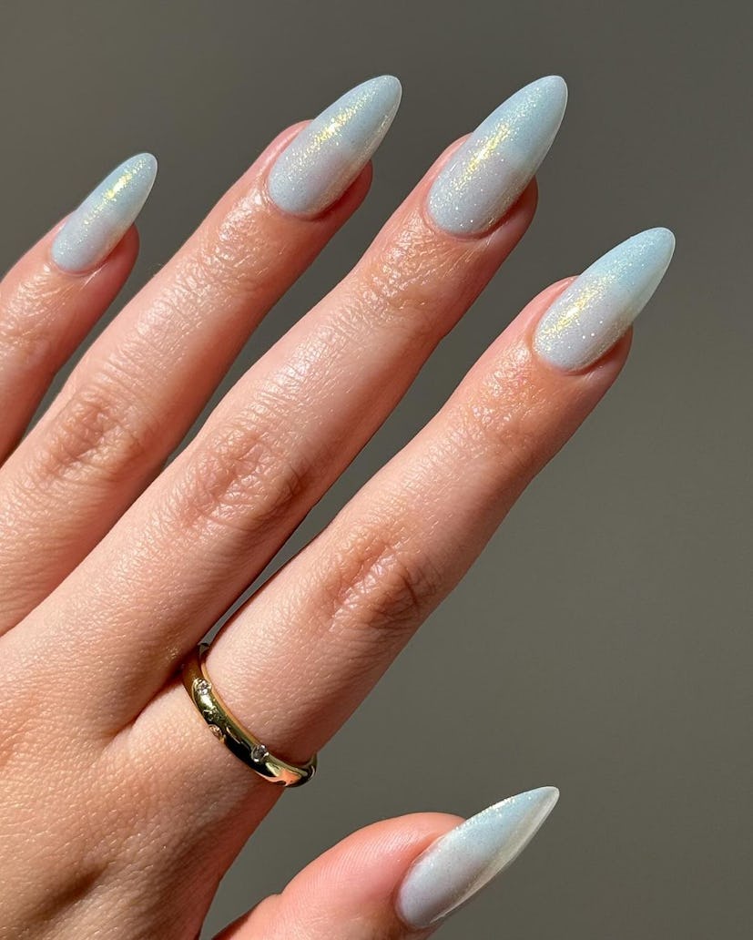 Shimmering pale blue nails are perfect for a Pisces on their wedding day.