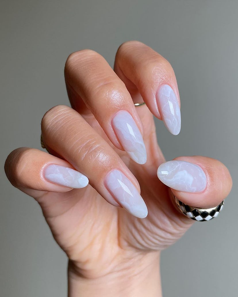 White marbled nail art is perfect for a Gemini on their wedding day.