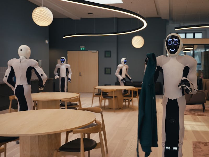 1X Eve robots cleaning up an office