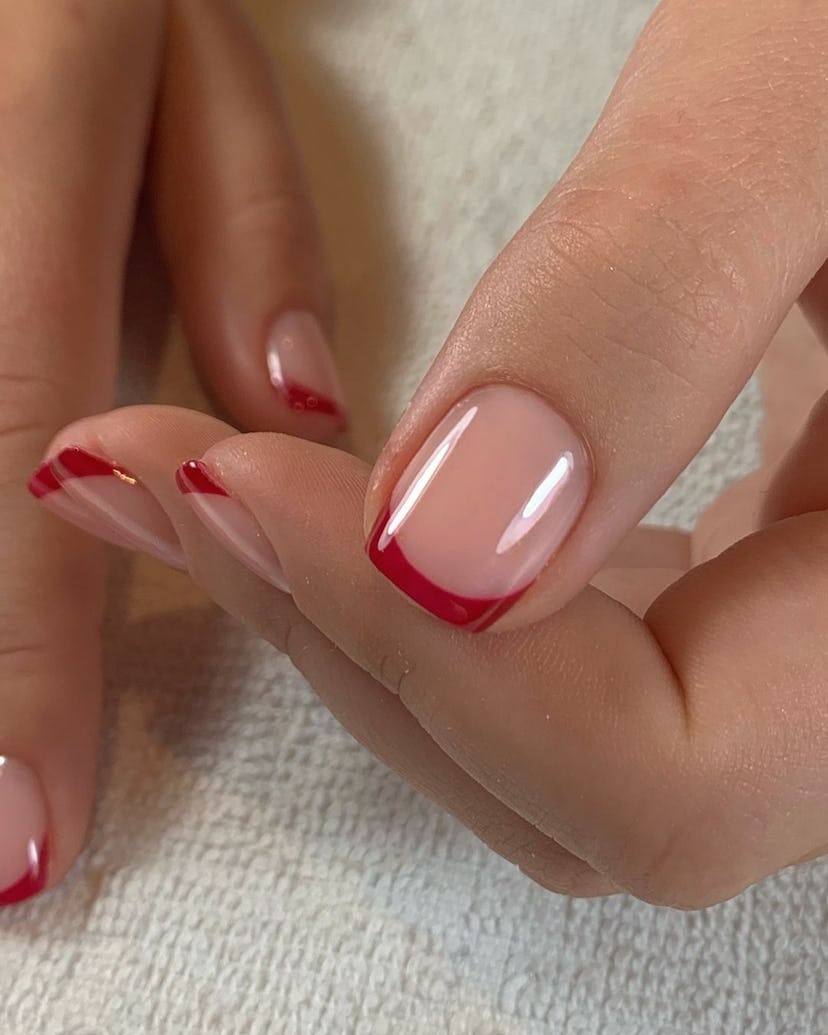 Red French tip nails are perfect for an Aries on their wedding day.