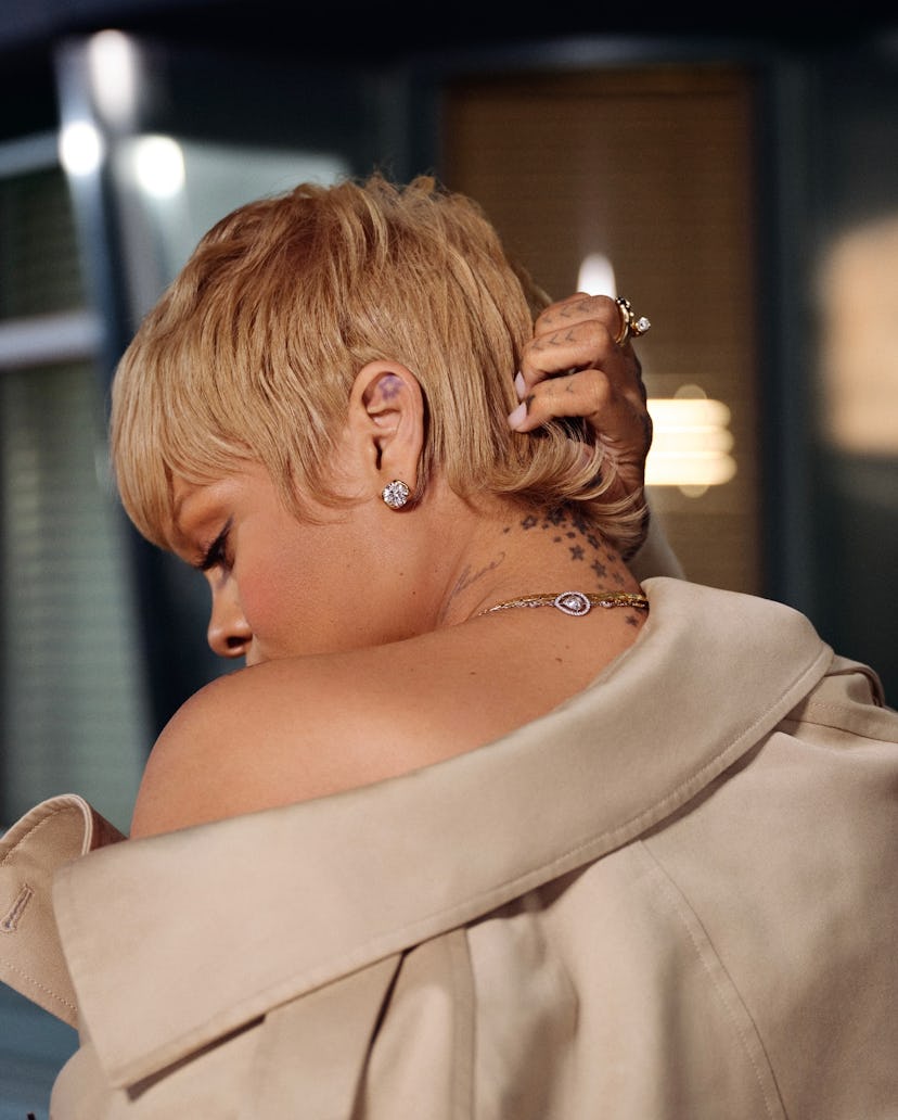Rihanna wore an oversized trench coat and diamonds to announce her new line of Fenty Hair products.