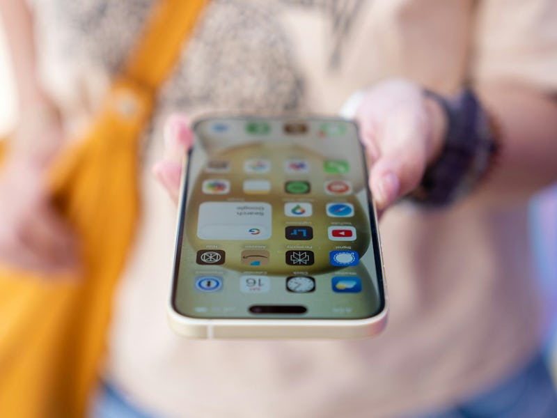 The iPhone 15 showing a home screen with apps.