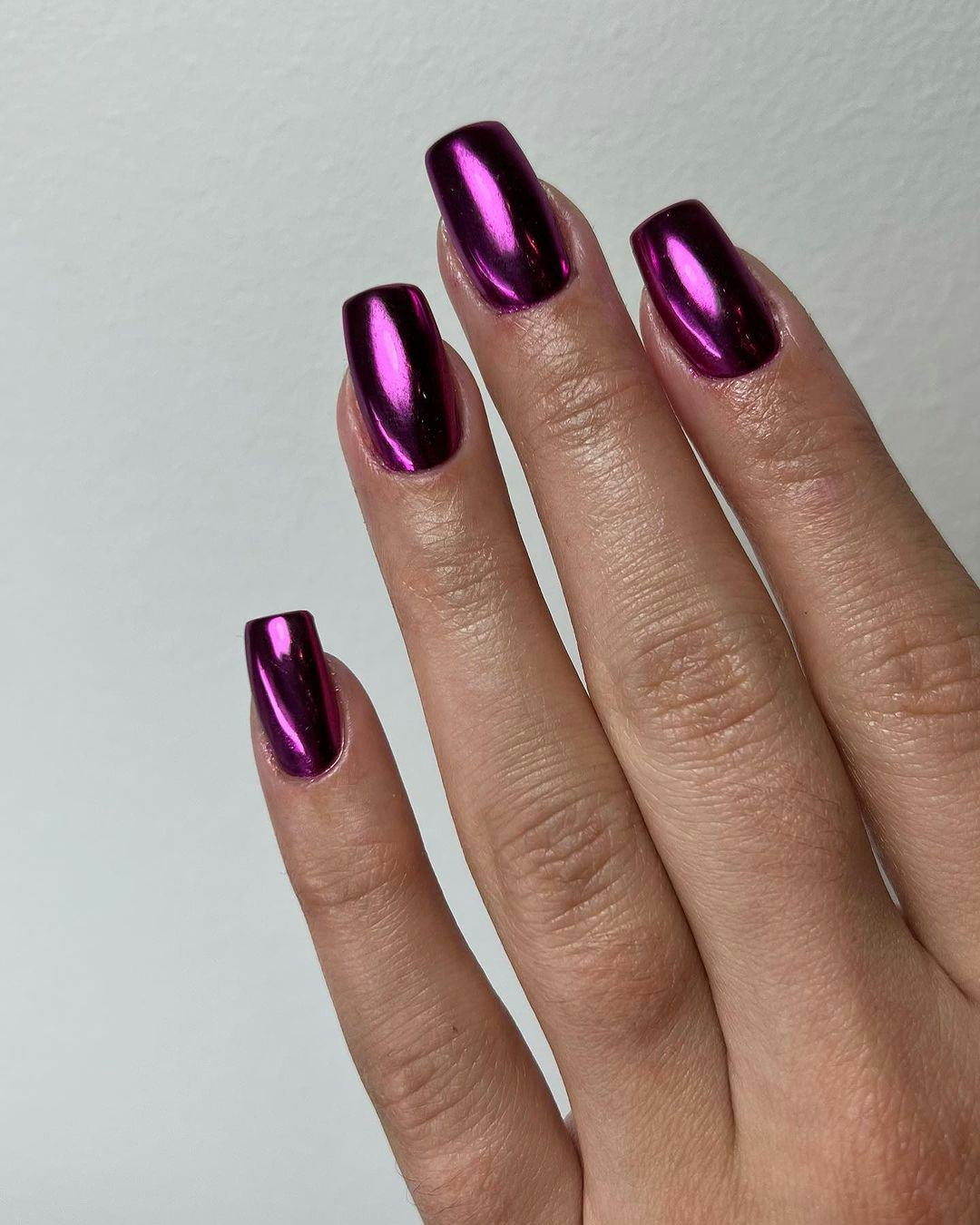 An Aquarius would wear purple chrome nails.