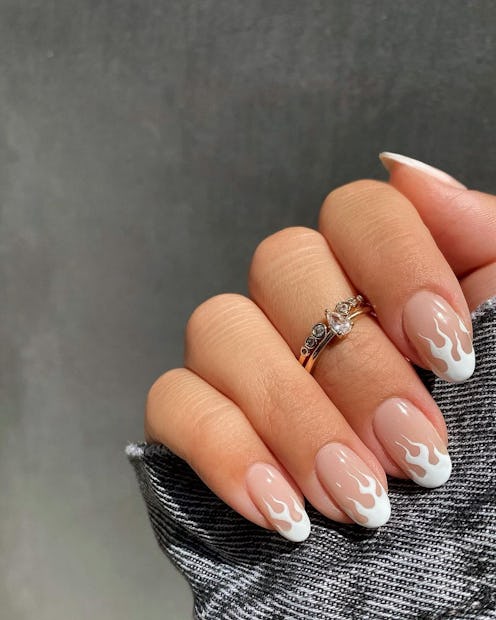 Here are 12 different ways to level up a classic white French tip manicure.