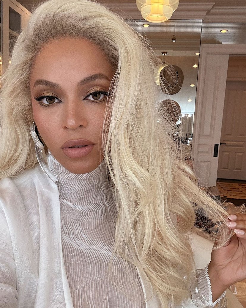 Beyoncé wears a sheer, all-white look.