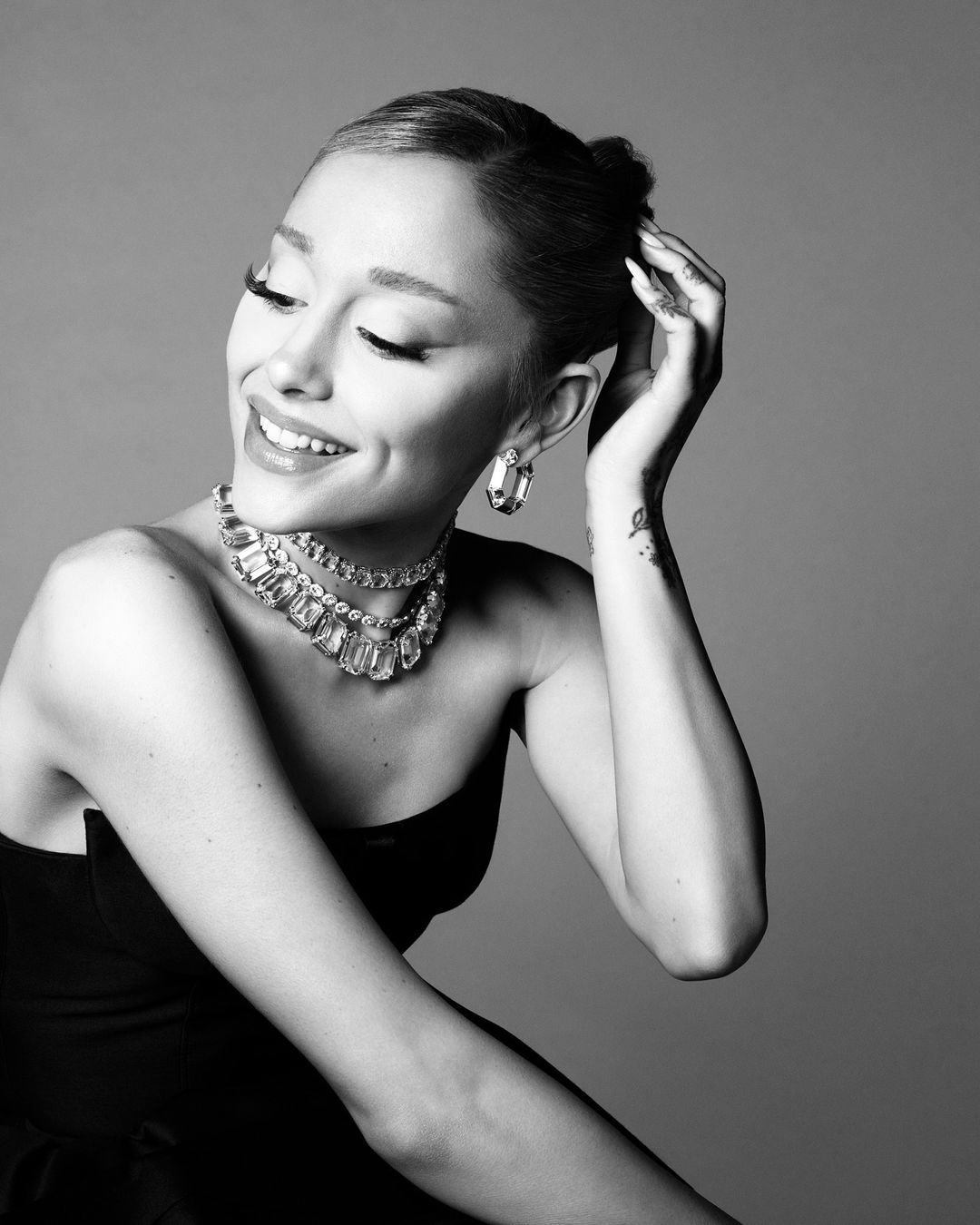 Ariana Grande sparkled in photos of her new Swarovski campaign.