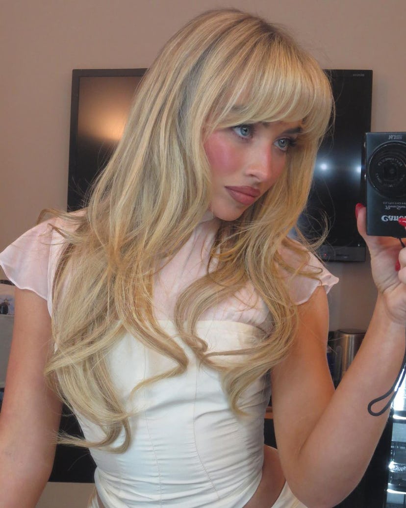 Curtain bangs are on-trend for fall 2024.