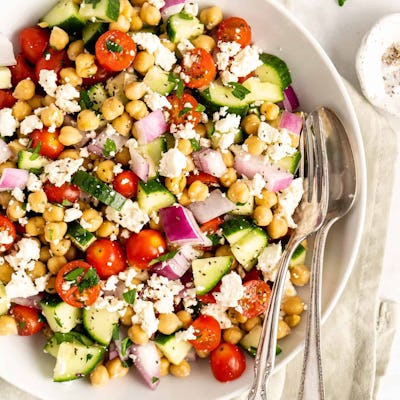Mediterranean chickpea salad, a dense bean salad recipe loaded with Mediterranean veggies and herbs.