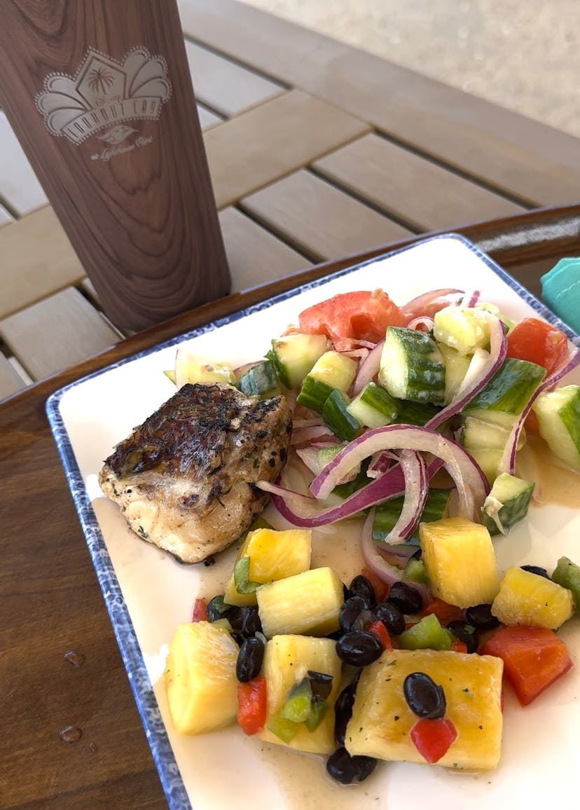 A photograph of the grilled snapper and salad available at Serenity Bay BBQ on Lookout Cay.