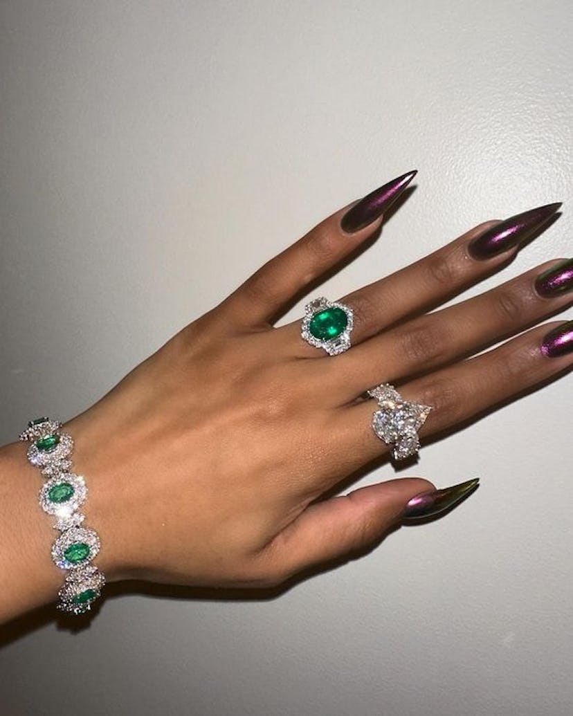 Megan Thee Stallion rocked a purple and gold holographic manicure.