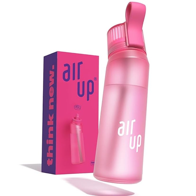 Pink water bottle labeled "air up" alongside matching pink packaging box with text "think new."