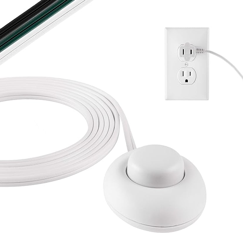 White cable with inline switch and flat plug connected to a standard electrical outlet, with part of...