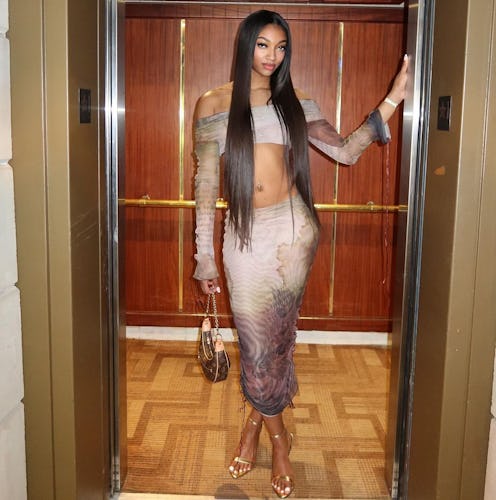 Angel Reese wears a crop top and skirt at the WNBA All-Star Game.