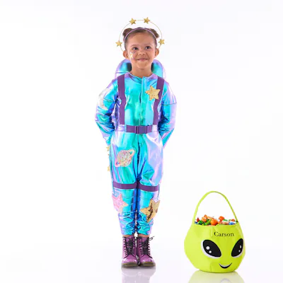 Little girl dressed in blue and purple astronaut costume with a crown of stars from Pottery Barn Kids