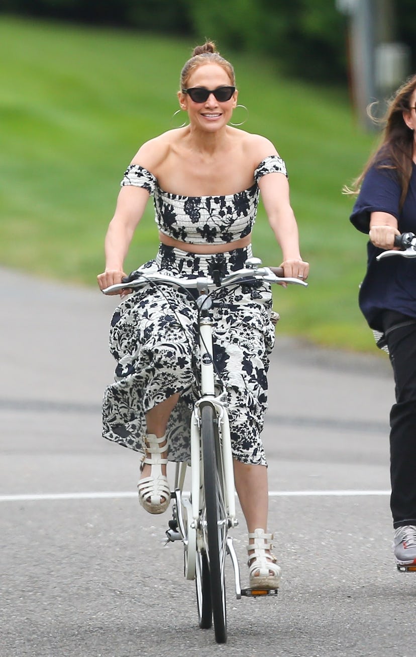 Jennifer Lopez wears a black-and-white floral top and skirt set. 