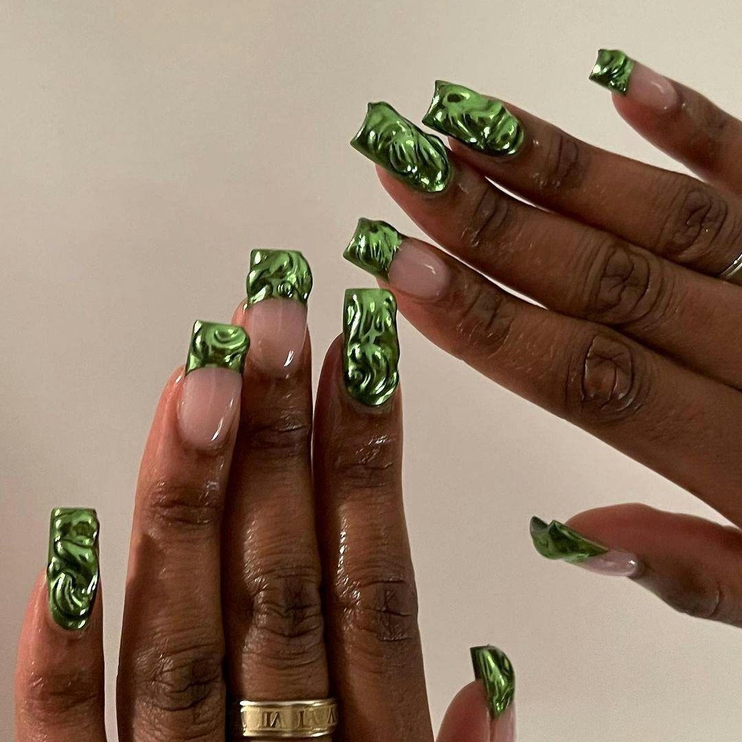 Green chrome manicures give &ldquo;brat summer&rdquo; vibes.