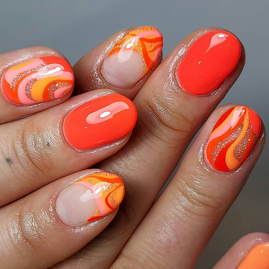 Try &ldquo;aperol spritz nails&rdquo; with sunset swirls.