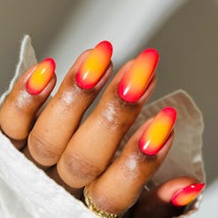 Craving a manicure to match your fave cocktail? "Aperol spritz nails" are the TikTok-loved trend for...