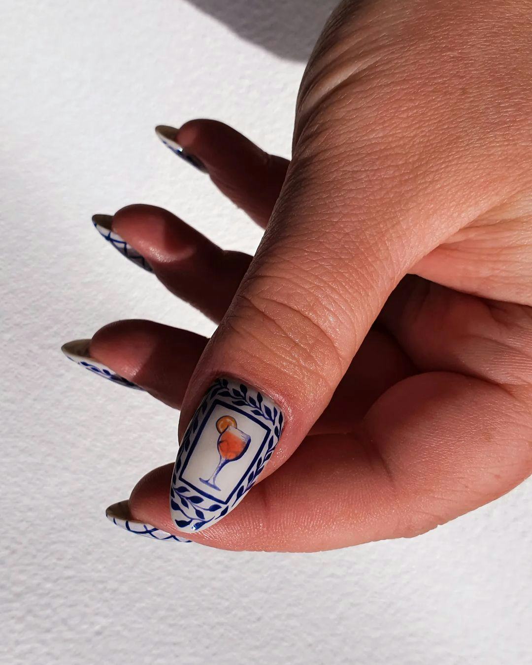 Try &ldquo;aperol spritz nails&rdquo; with realistic cocktail manicure art.