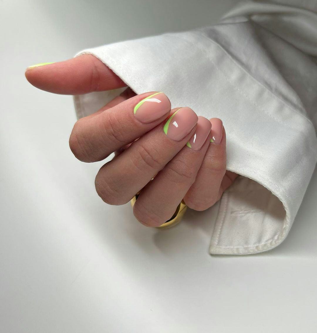 Simple green nail cuffs give &ldquo;brat summer&rdquo; vibes.