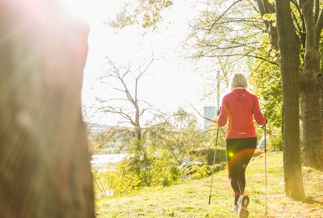 A woman does Nordic walking.