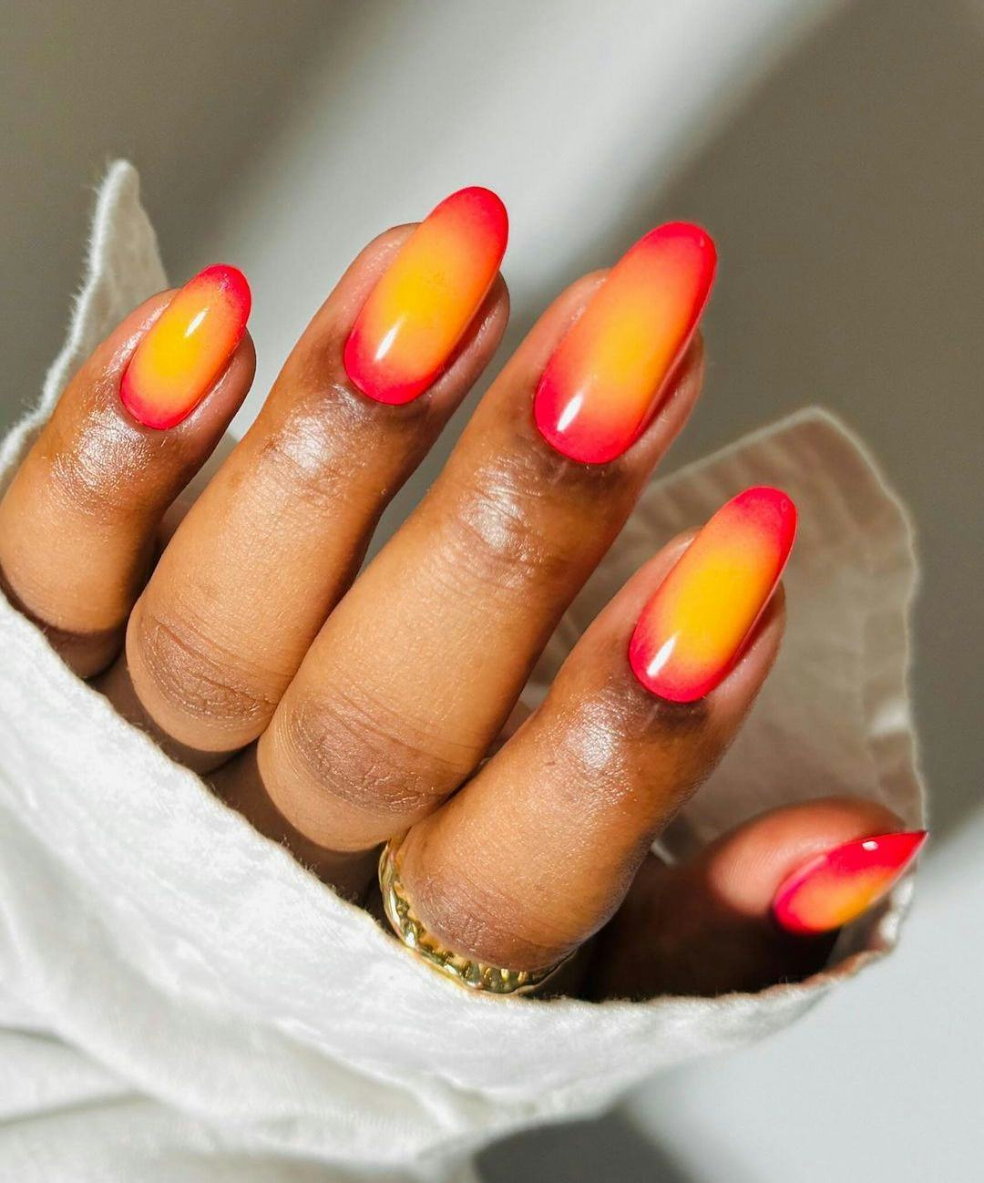 Try &ldquo;aperol spritz nails&rdquo; with orange aura art.