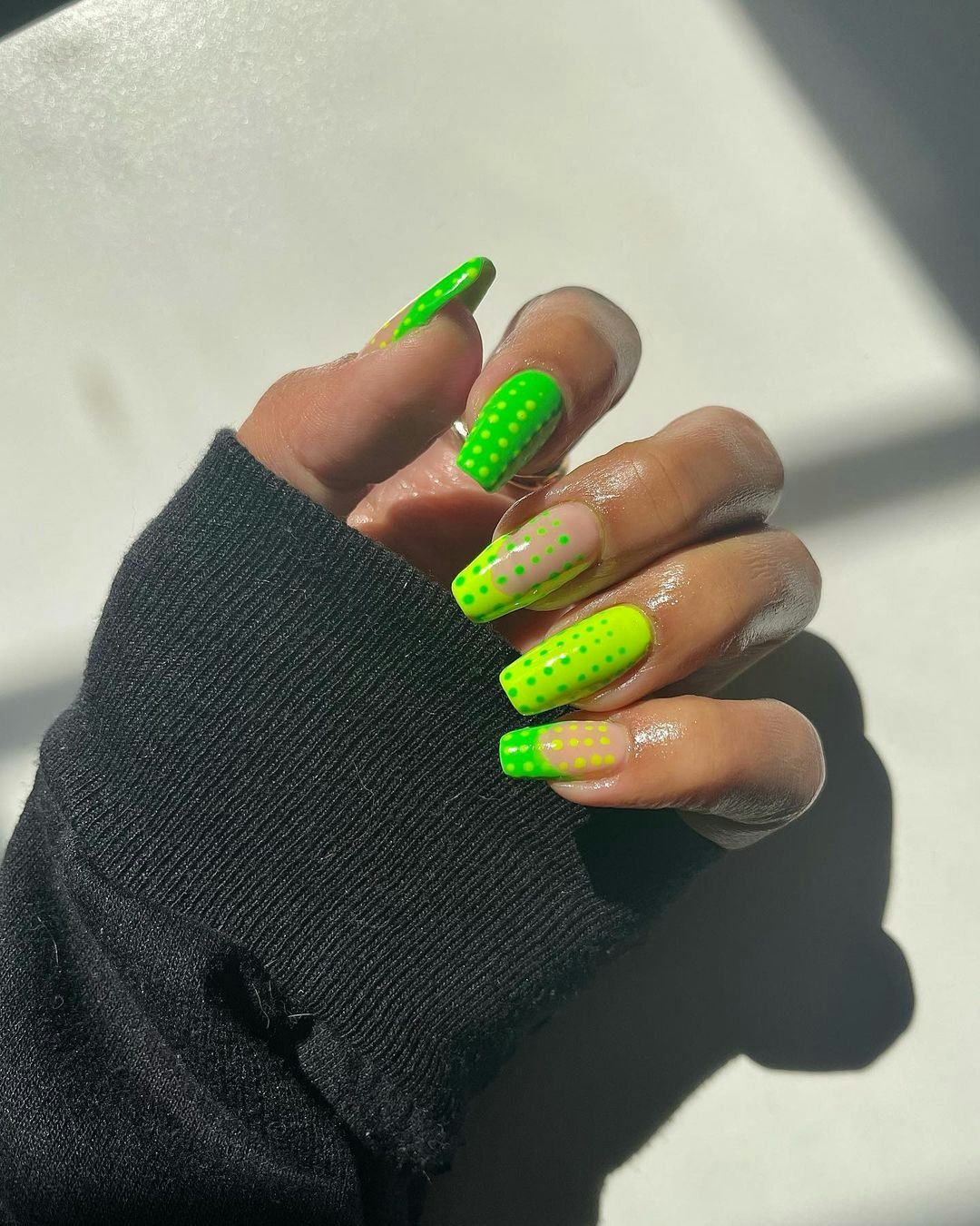 Two-toned green nails with micro dots give &ldquo;brat summer&rdquo; vibes.