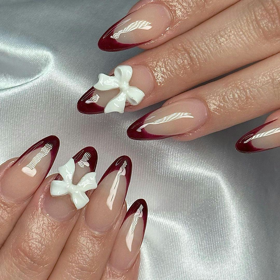 Try &ldquo;black cherry&rdquo; French tip nails for fall 2024.