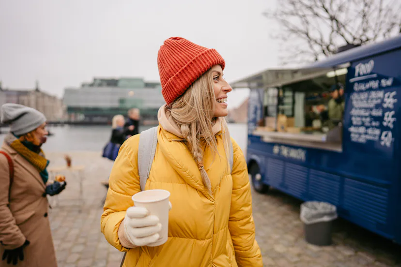 A woman drinks coffee in Copenhagen