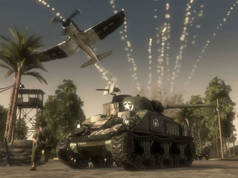 A plane flies overhead past a tank.