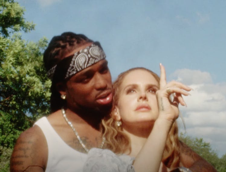 Quavo and Lana Del Rey embrace in their new music video