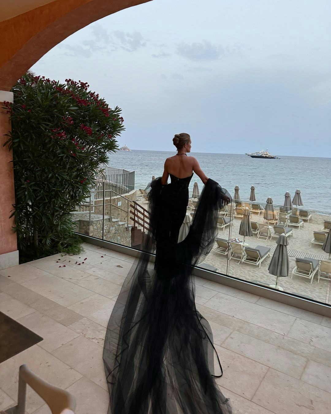 Rosie Huntington-Whiteley wears a sheer bustier LBD in Italy.
