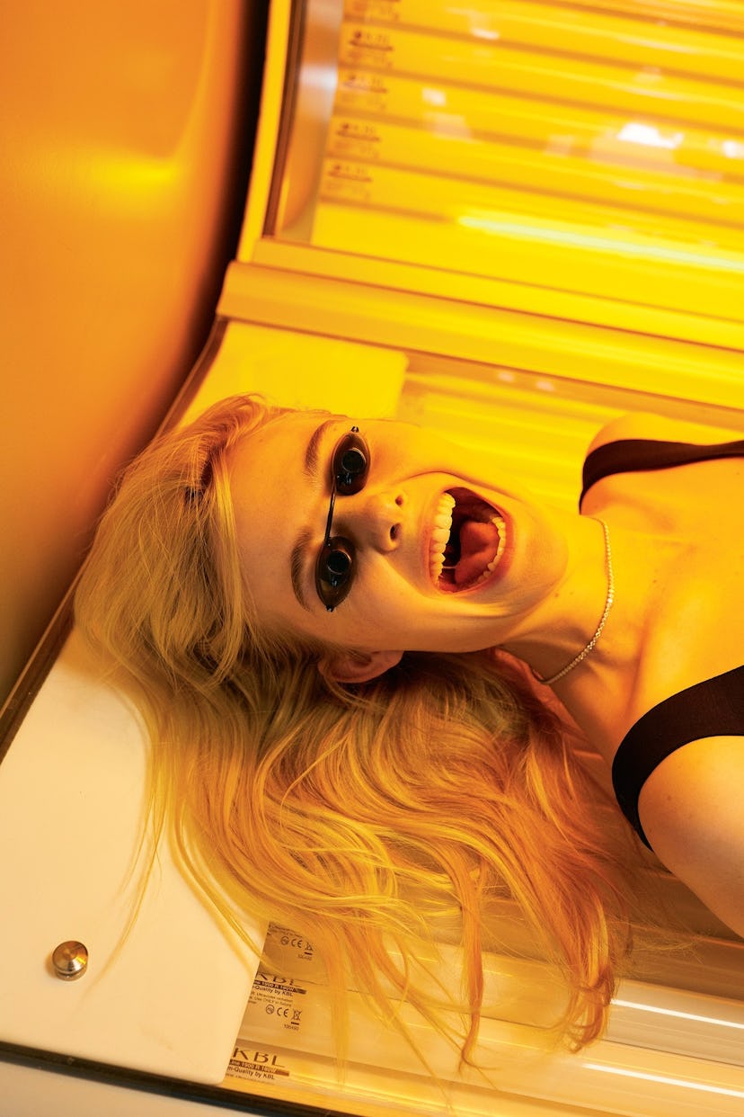 elle fanning in a tanning bed
