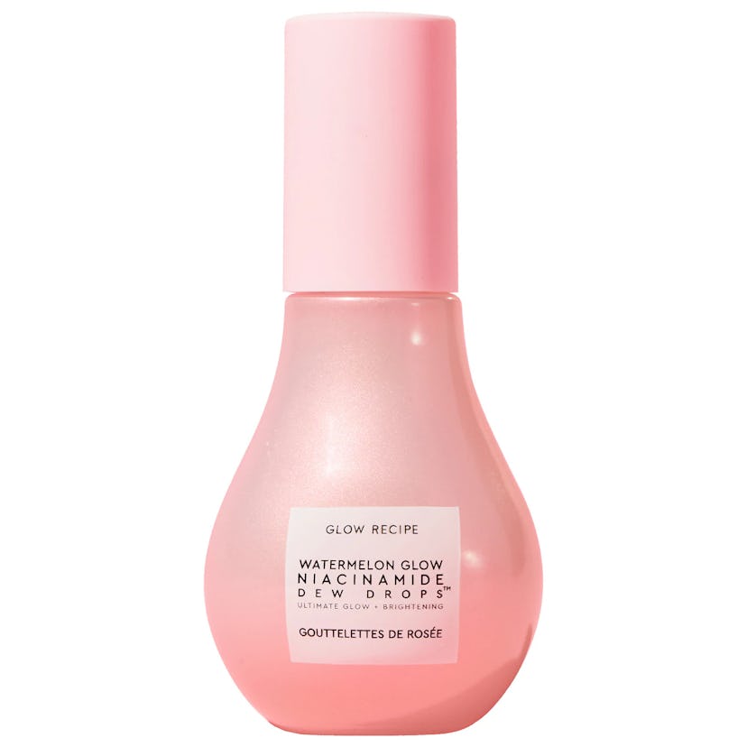 A pink bottle of Glow Recipe Watermelon Glow Niacinamide Dew Drops, designed in a gentle flask shape...