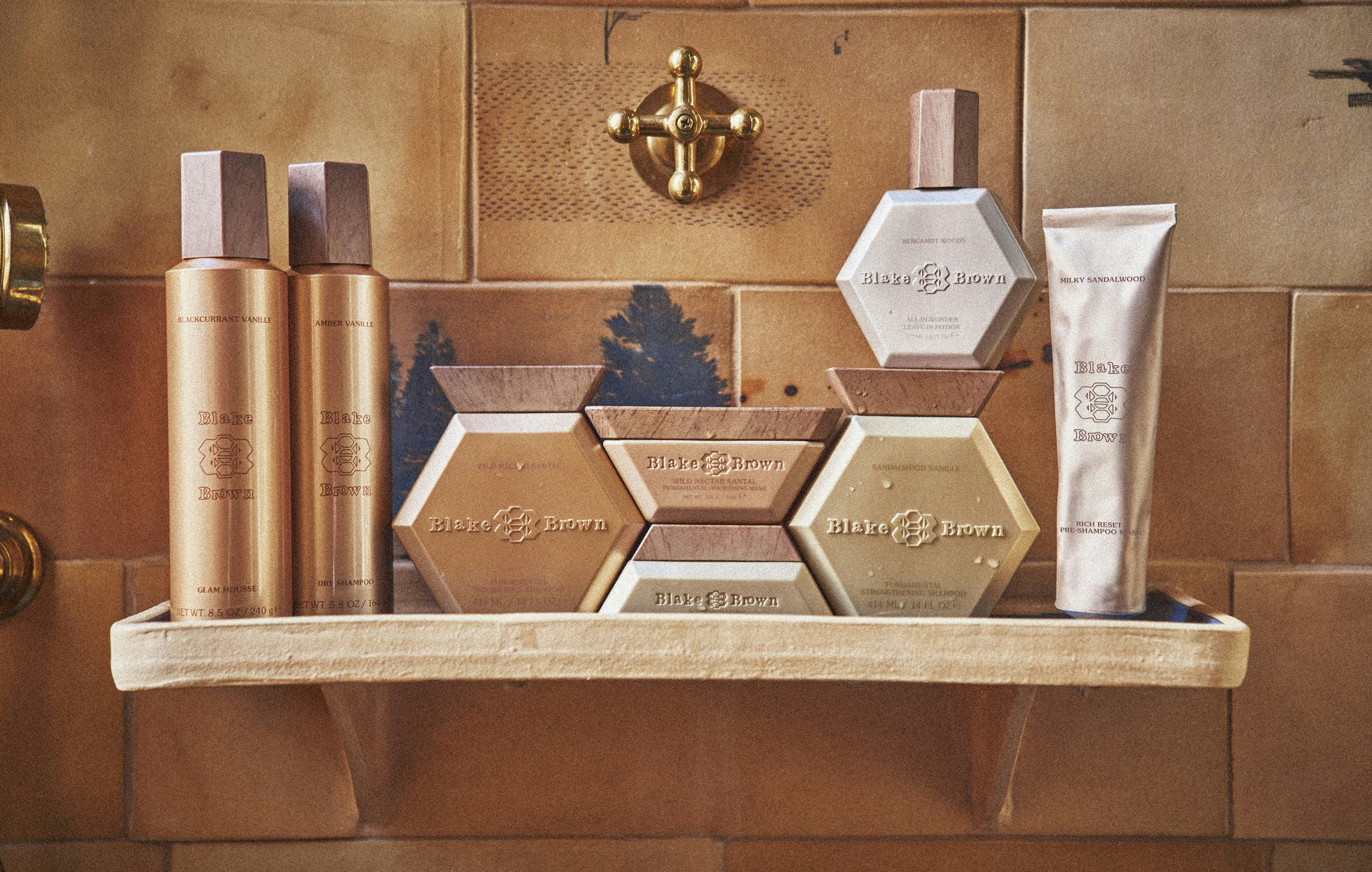 Blake Brown products on a marble shelf against a tiled wall, featuring bottles and geometrically sha&hellip;